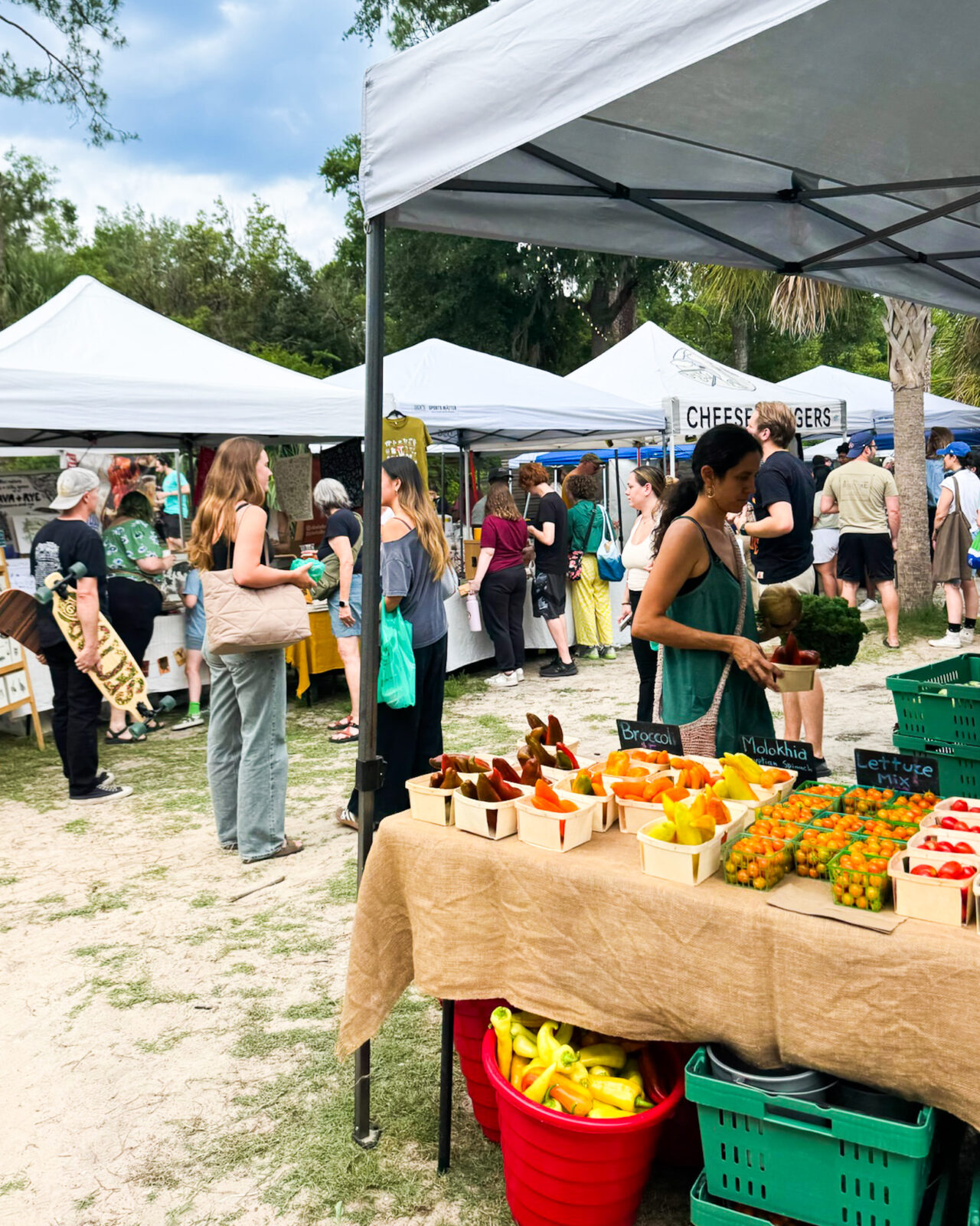 People buying fresh produce at a Florida farmers market