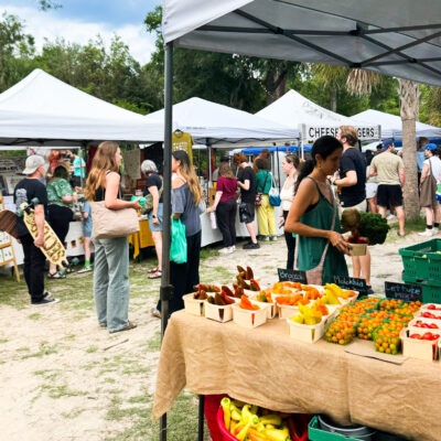 People buying fresh produce at a Florida farmers market